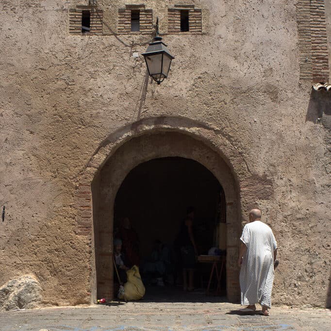 Bab El Ain stone gate at dawn, Chefchaouen medina entrance, Morocco Blue City