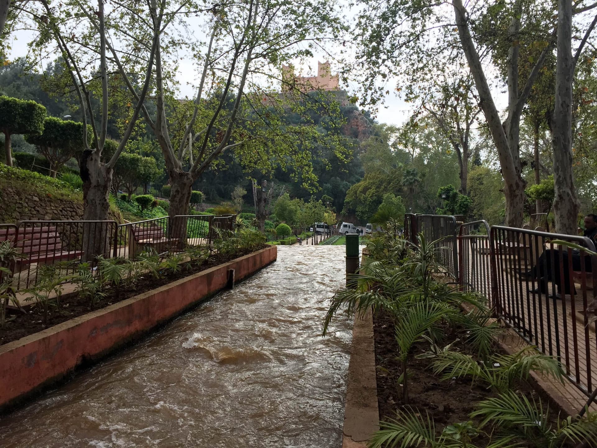Ain Asserdoun gardens with the hilltop kasbah fortress above Beni Mellal, Morocco