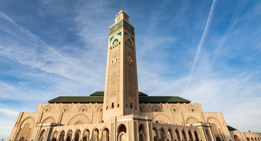 Casablanca's Hassan II Mosque minaret, a final skyline view before departure from CMN airport