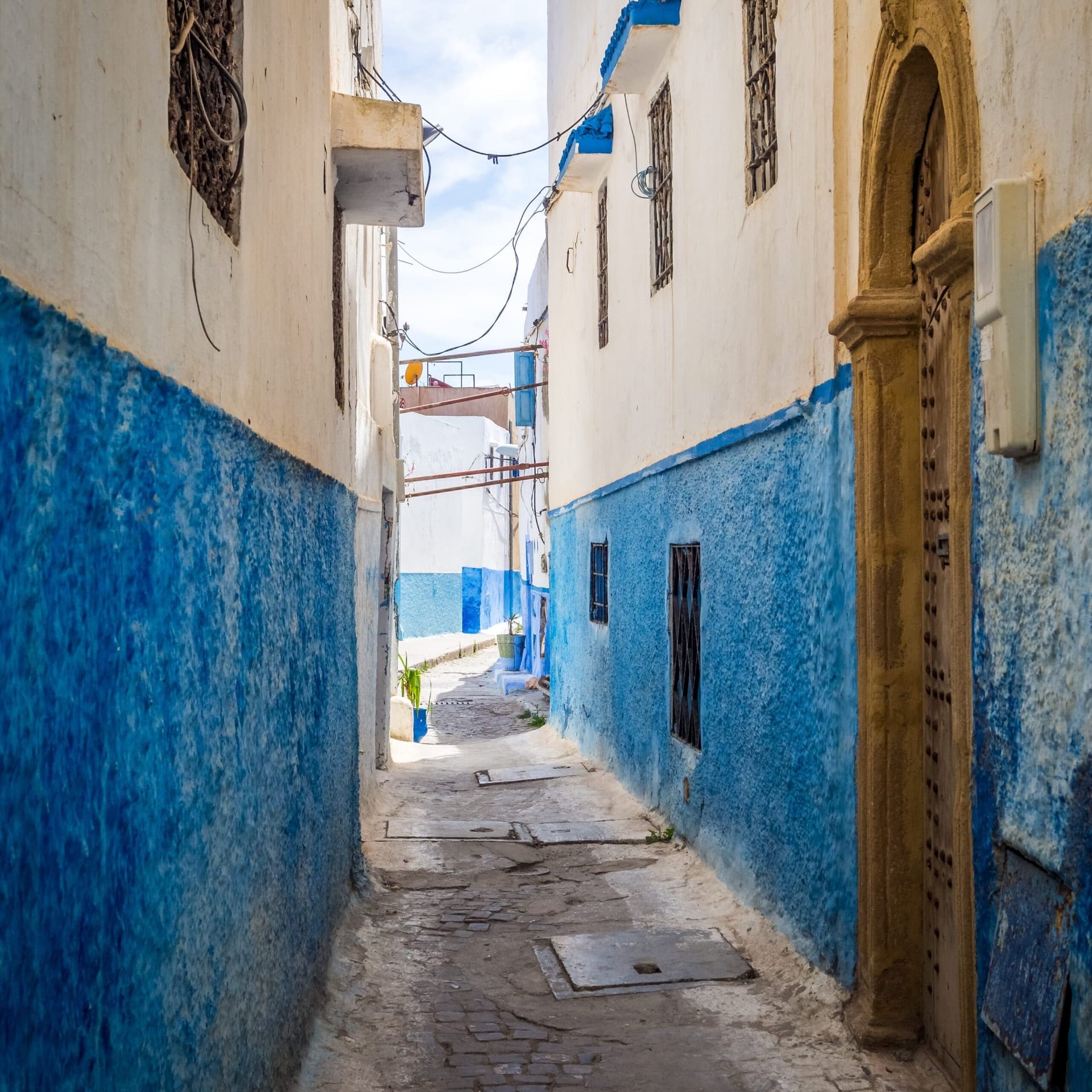 Blue-washed alleyway in the Kasbah of the Udayas, Rabat, Morocco road trip stop