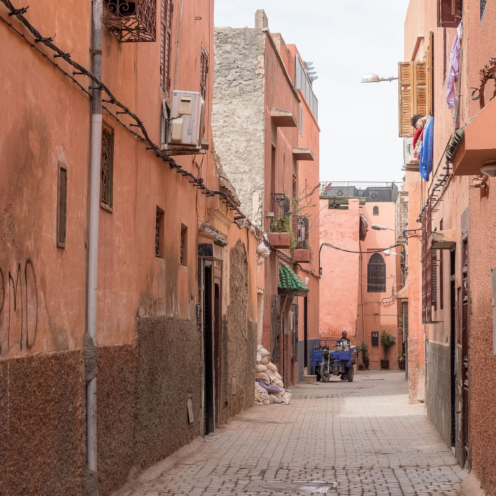 Narrow ochre-walled alleyway in Marrakech's historic Mellah quarter