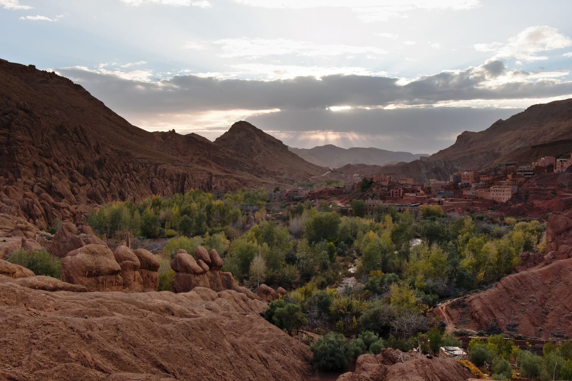 Winding mountain road through green terraced valleys of the Middle Atlas foothills