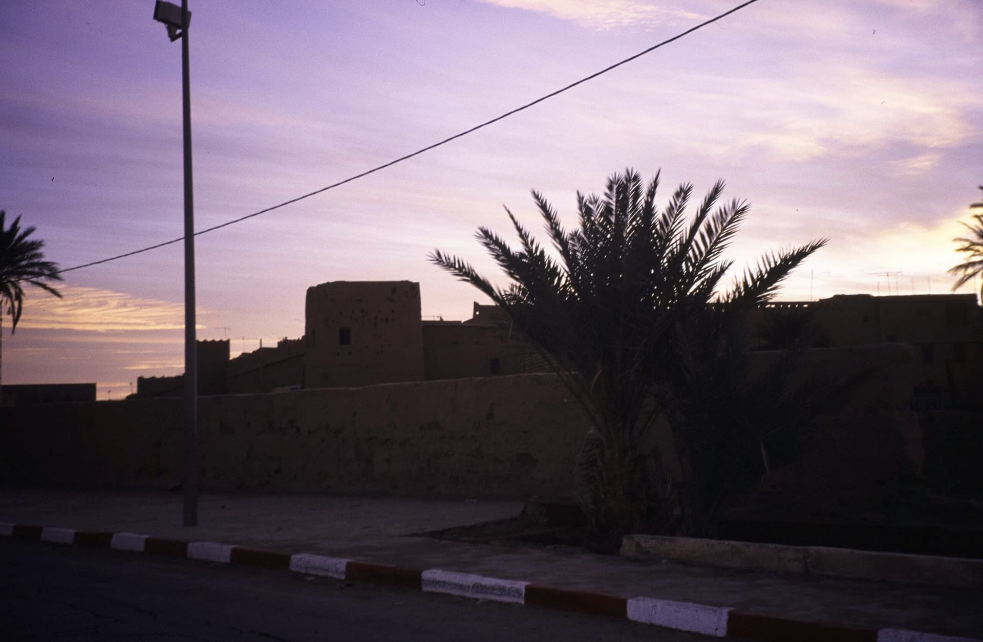 Historic city wall with square towers near old Rissani, close to the Sijilmasa site, Morocco