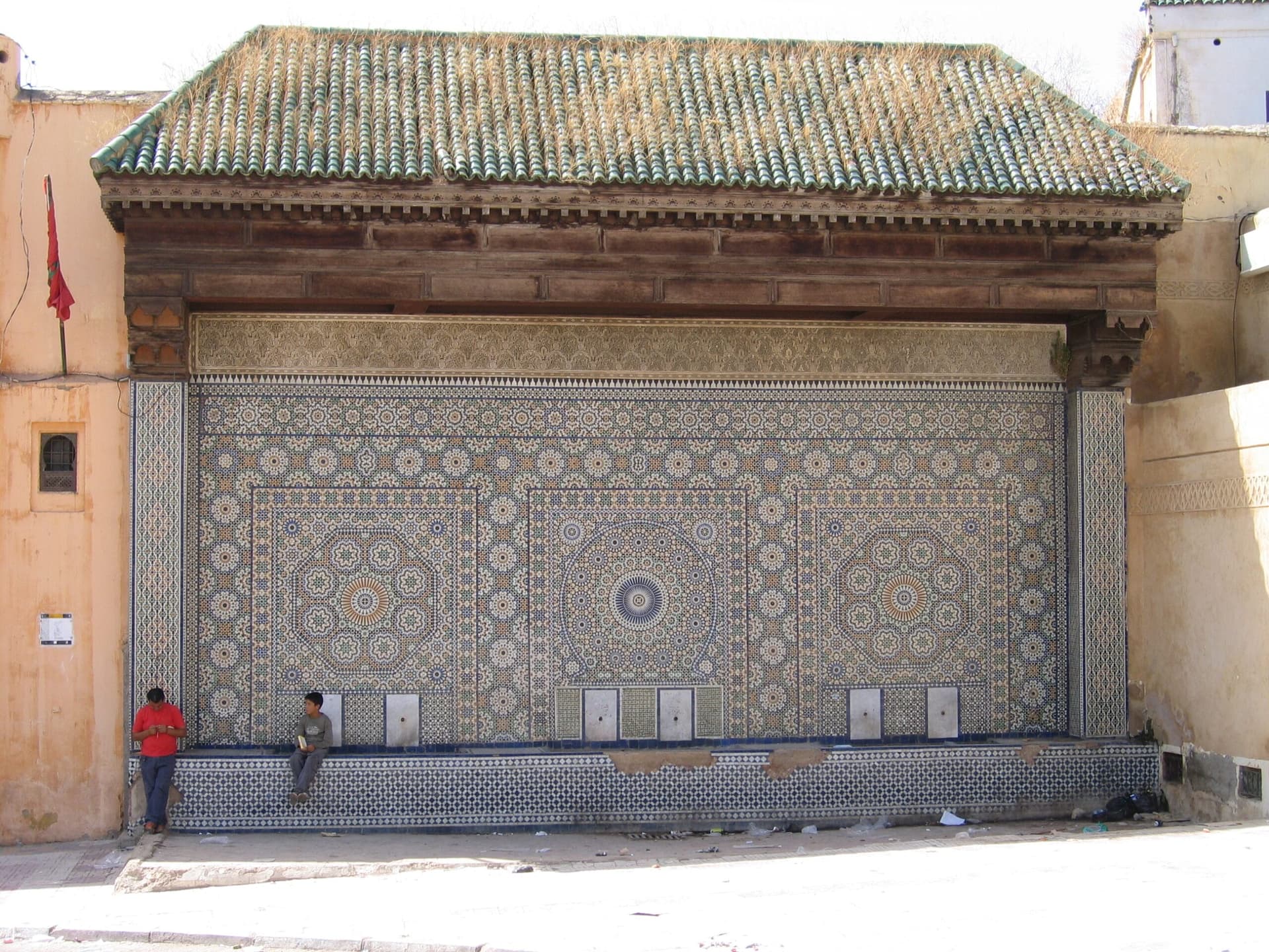 Tiled fountain along a Rouamzine medina street in Meknes
